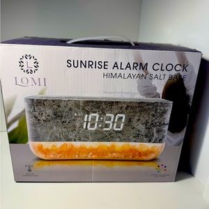 Sunrise digital alarm clock with faux marble top and crystal rock bottom.
